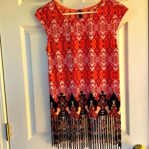 fringe, bottom, three-quarter length summer top. Right